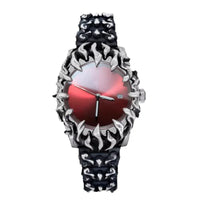 Wristwatch with intricate design and red face on a white background