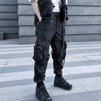 Black ribbon buckle techwear pants with an elastic waist