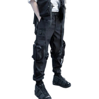 Black ribbon buckle techwear pants with an elastic waist