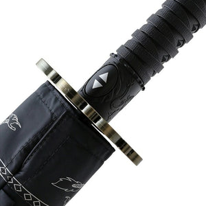 Close-up of the metal tsuba guard and wrapped handle of the katana umbrella