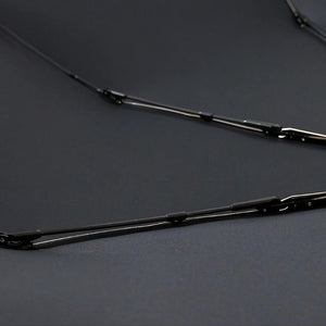 Close-up of the black metal ribs of the katana umbrella