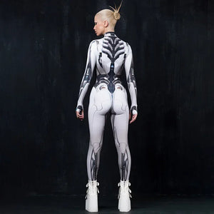 Person wearing a futuristic white and black bodysuit against a dark background