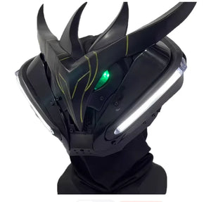 Black futuristic helmet with glowing green eyes on a white background