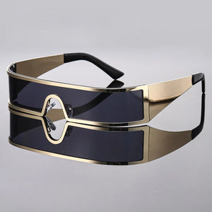Sunglasses with gold frame and black lenses on a gray background