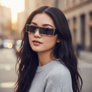 Woman wearing futuristic sunglasses on a city street