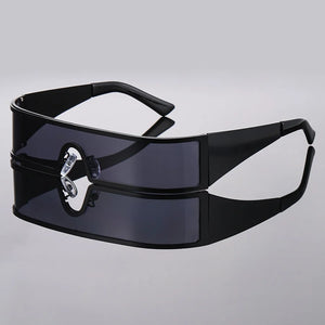 Black sunglasses with a decorative metal clasp on a light gray background