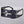 Black and silver visor-style sunglasses on a gray background