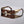 Gold and brown sunglasses on a gray background