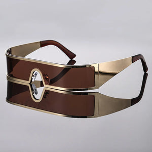 Gold and brown sunglasses on a gray background