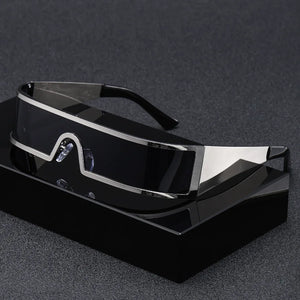 Black and silver futuristic sunglasses on a dark gray background