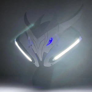 Dragon-shaped object with glowing elements on a dark background