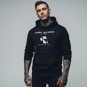 Man wearing a black hoodie with visible branding in an urban setting