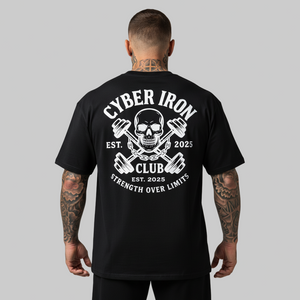 Man wearing a black t-shirt with 'Cyber Iron Club' design on the back, on a gray background