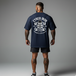 Person wearing a navy blue t-shirt with 'Cyber Iron Club' design on the back against a gray background