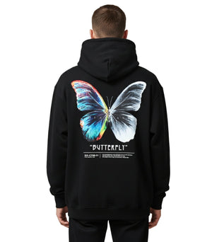 Person wearing a black hoodie with a colorful butterfly graphic on the back against a plain background