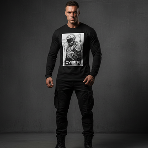 Man wearing a black long-sleeve shirt with a graphic design on a gray background