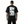 Person wearing a black t-shirt with anime-style graphics on the back, featuring the brand 'Cyber Techwear'.