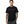 Man wearing a black t-shirt with 'CYBER TECHWEAR' text in pink on a white background
