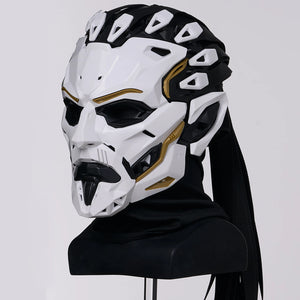 White and black mask with gold accents on a mannequin head against a white background