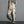 Khaki label techwear joggers with black and yellow patches on the cargo pockets, woman standing in three-quarter view