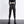 Black toggle Ankle Cuff Techwear Joggers, front view on a woman with a crop top, cargo pockets and platform boots