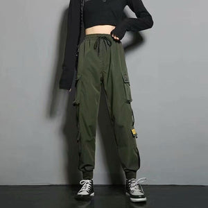 Army green label cargo joggers, front view with a drawstring waist and yellow label patches on the thigh pockets
