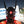 Black techwear mask with tall antenna blades and a red triangle indicator