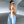 Asymmetric Lace Y2K Top in white, back view with the long lace ties hanging over light jeans