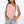 Asymmetric Lace Y2K Top in pink, front view of the pointed hem worn with light jeans and a white bag