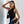 Asymmetric Lace Y2K Top in black, one-shoulder lace with the side cut away, hand raised to the head
