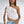 Asymmetric Lace Y2K Top in white, sheer one-shoulder lace worn with light jeans and a white bag