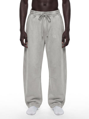 Light Gray baggy sweatpants worn front view on a white background, drawstring tied and loose wide legs