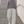 Light Gray barrel leg sweatpants worn front view, hands in pockets, drawstring waist and white sneakers
