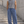 Washed Blue barrel leg sweatpants worn front view, faded blue wash, loose curved leg and drawstring