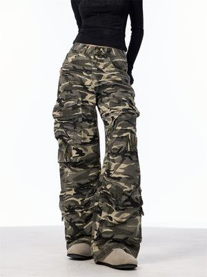 Side view of the camo cargo pants showing the stacked cargo pockets down the leg and the pooled hem