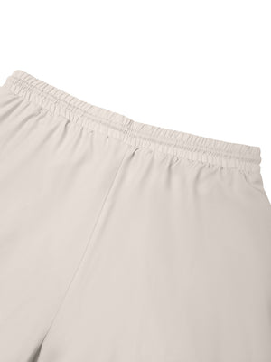Detail of the elastic waistband and side seam on the back of the Pale Khaki lined workout shorts
