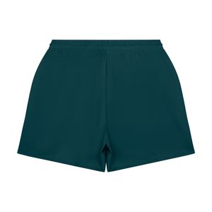 Dybturkise baggy gymshorts set bagfra, lagt fladt med elastisk talje og løse ben