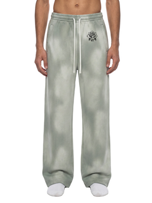 Light Gray baggy sweatpants worn from the front, cloudy sun faded wash, elastic waist and white drawstring