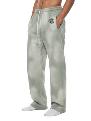 Light Gray wide leg sweatpants in three-quarter view, hand in the slash pocket, rose print near the waistband