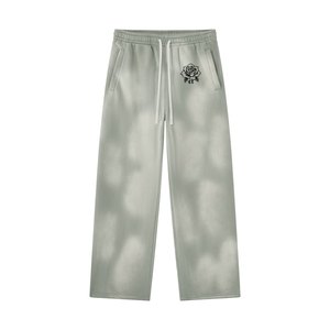 Light Gray Baggy Sun Faded Y2K Sweatpants laid flat, front view showing the drawstring and the rose print