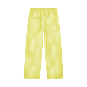 Yellow wide leg sweatpants laid flat from the back, showing the two back pockets and the cloudy wash