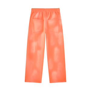Orange wide leg sweatpants laid flat from the back, two patch pockets and a full length straight leg