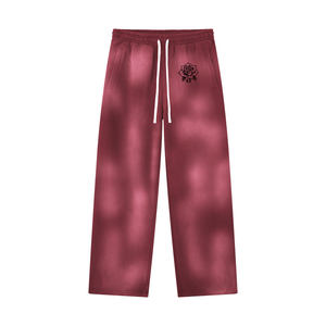 Dark Red sun faded sweatpants laid flat, front view with the white drawstring and the small rose print