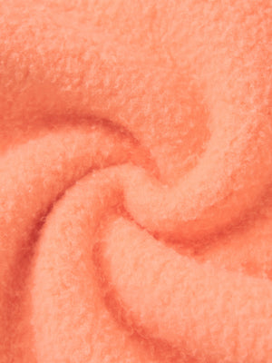 Close-up of the soft fleece inside the Orange sweatpants, extra thick knit with a brushed surface