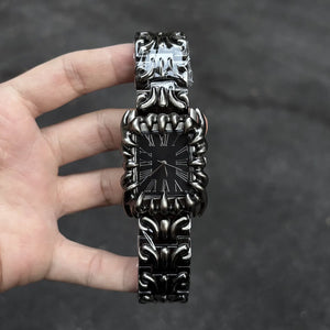 Silver baroque watch with a rectangular red dial and Roman numerals