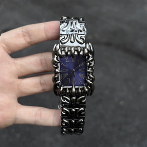 Silver baroque watch with a rectangular red dial and Roman numerals