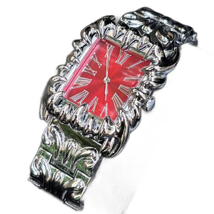 Silver baroque watch with a rectangular red dial and Roman numerals