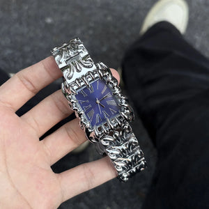 Silver baroque watch with a rectangular red dial and Roman numerals