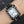 Silver baroque watch with a rectangular red dial and Roman numerals