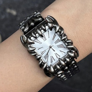 Silver baroque watch with a rectangular red dial and Roman numerals